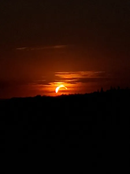 sunset during partial eclipse